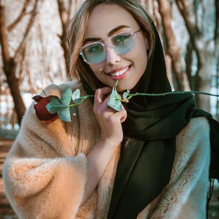 Kaveri Mehta, Lead Design Curator at SummitTrailView, reviewing corporate floral arrangements